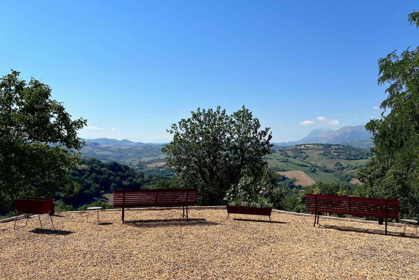 Terrace with benches overlooking the Le Marche hills